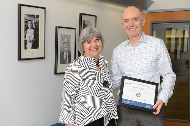 Danuta A. Nitecki, Dean of Libraries, gives John Wiggins his award during the Librares celebration awards event